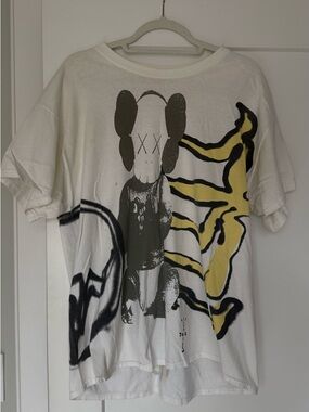 This item is a Travis Scott Cactus Jack + Kaws for Fragment Tee (collaboration)
